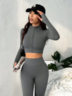 o Conjunto Esportivo de Top de Manga Longa com Zíper na Frente e Calça Flare de Cor Sólida, Sem Costura